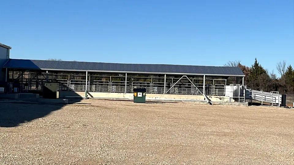 Covered livestock pens on the side of the Creek Ranch plant