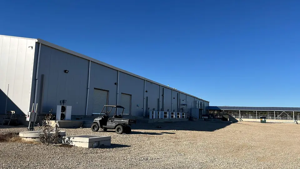 The Creek Ranch Meat Processing plant, a long white metal building on County Road 4781 in Boyd, Texas